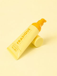 Frasique Light-Up Face Moisturiser yellow bottle with a pump on a yellow background