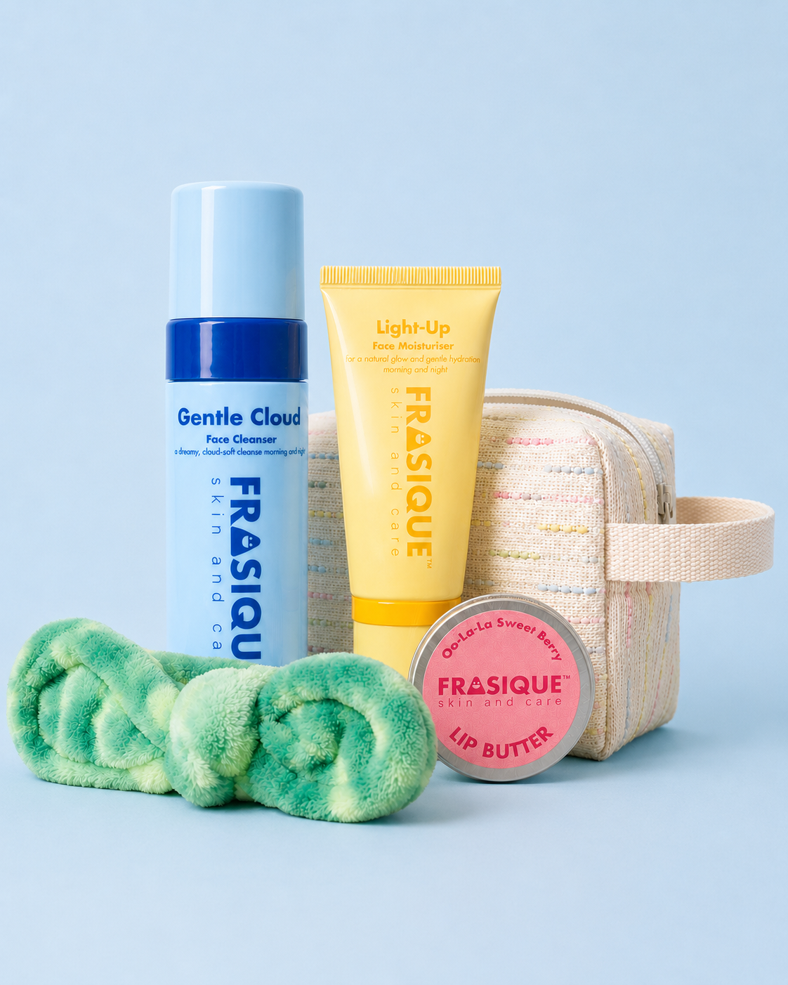 FRASIQUE skincare product bundles for tweens and teens including a face cleanser, face moisturiser, lip balm, headband and toiletry bag on a light blue background.
